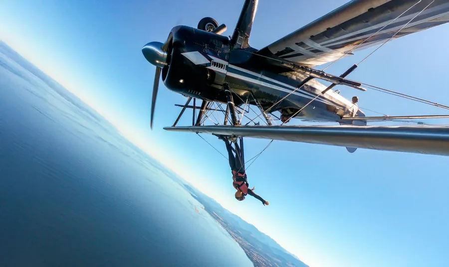 Close-up of a propeller plane high above the horizon